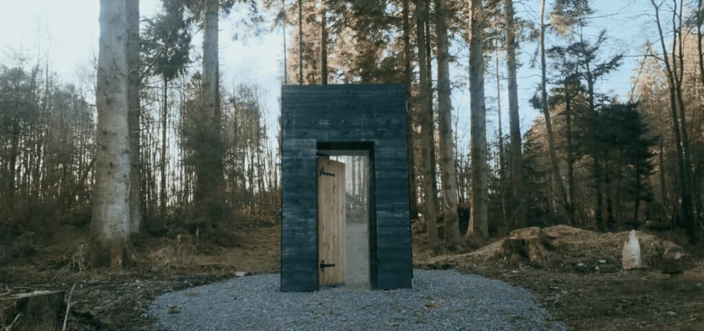 door open in the middle of wooded area